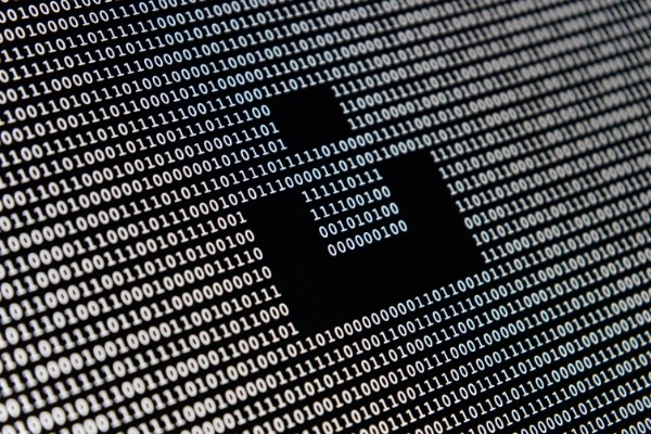 Computer screen covered in binary.