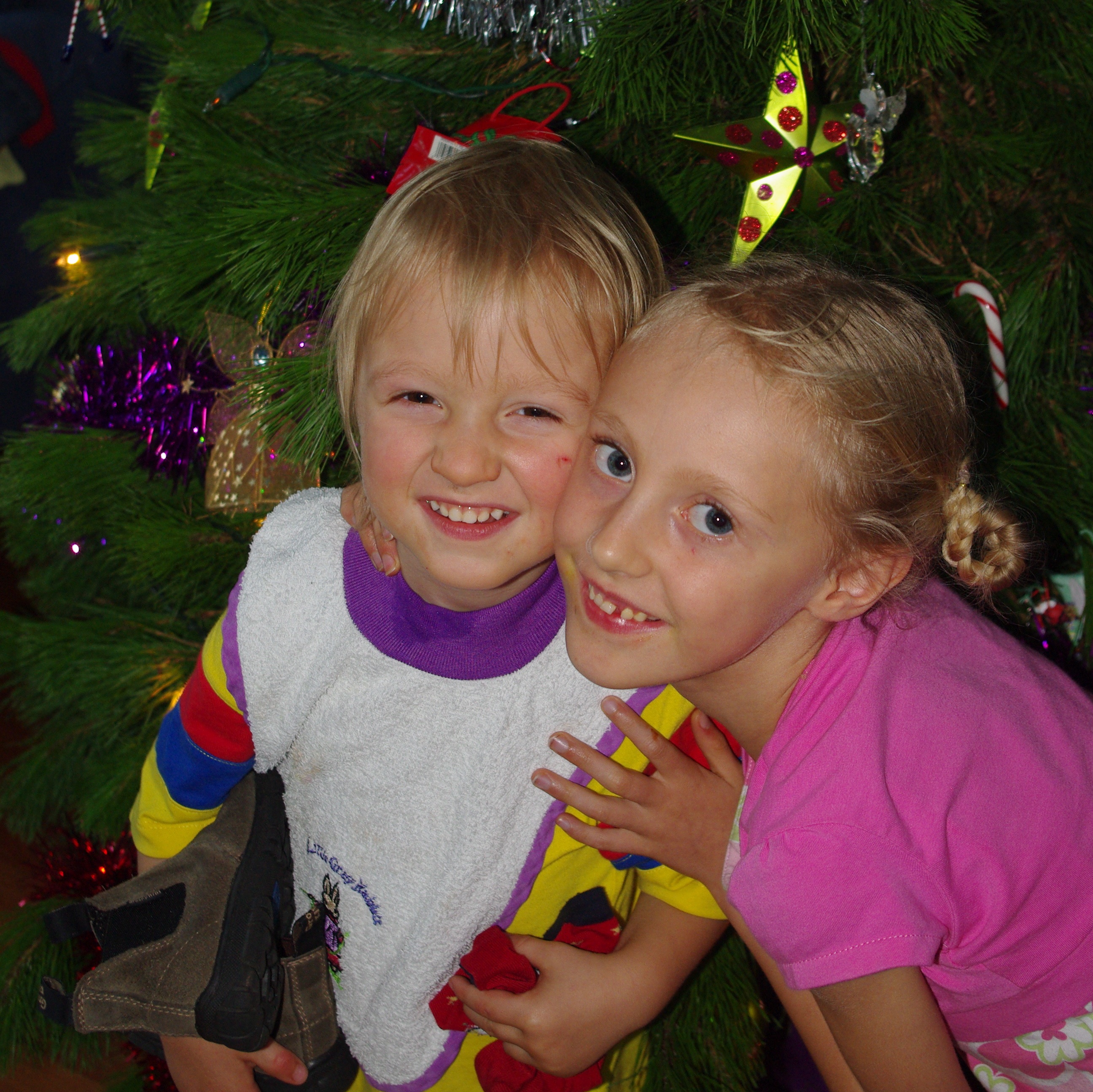 Two Children around a christmas tree